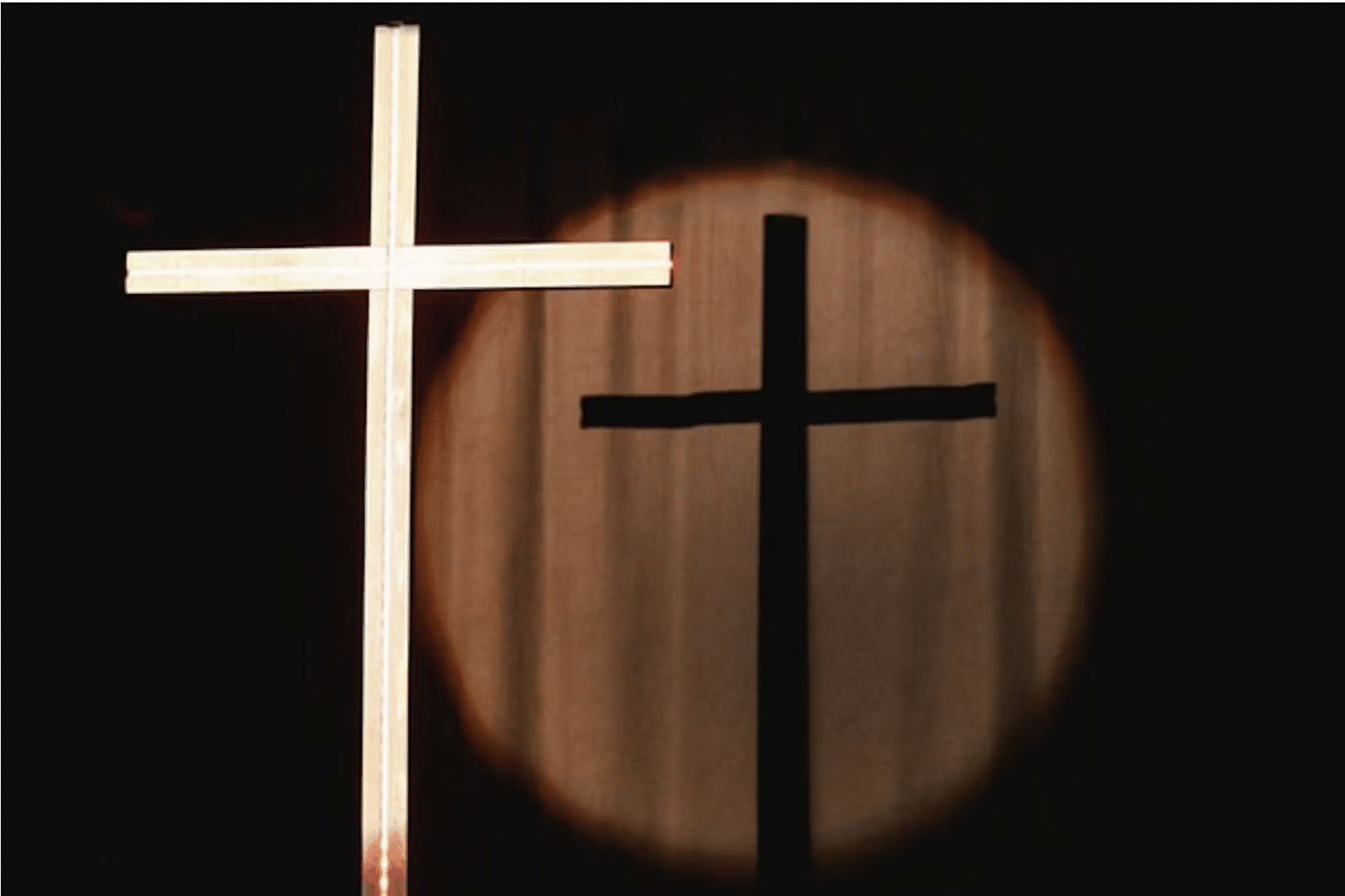 A picture of a cross and its shadow.